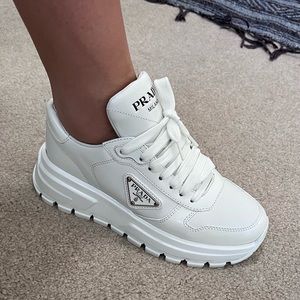 White Brand New Authentic Prada Sneakers women’s size 35. Cute tennis shoes!